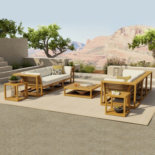 70234 maya modular twin sofa collection set with cushions three throw pillows angled view on carpeted concrete patio with landscaped canyon view in background