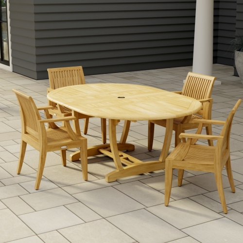 70305 Martinique 5 piece Dining Set of Martinique Oval Dining Table and 4 Laguna Dining Chairs in angled end view on stone patio with a house and pillar in the background