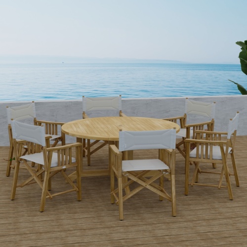 70362 Barbuda Director 7 piece Teak Dining Set of 6 Director Chairs and Round 60 inch diameter folding teak dining table side view with ocean and blue sky background  