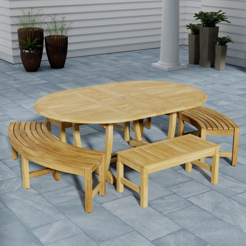 70380 Martinique 5pc Bench Dining Set of Teak Oval Dining Table and 2 Backless Curved Benches and 2 Backless Stools on outdoor patio with wall and potted plants in background