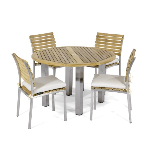 70438 Vogue Dining Set for 4 of Vogue Teak and Stainless Steel 48 inch Round Dining Table and 4 Vogue Stacking Dining Chair with optional seat cushions angled on white background 