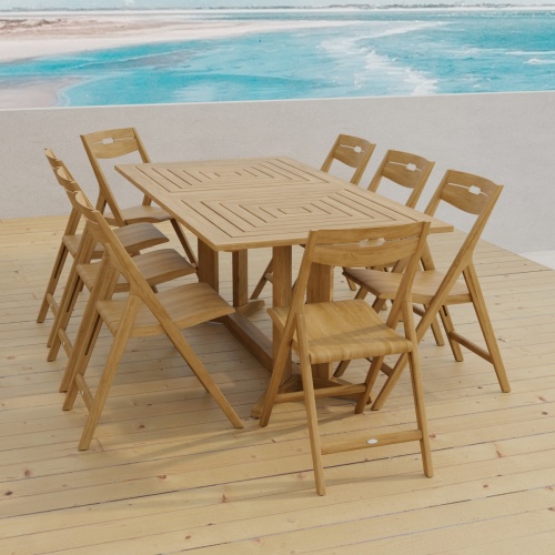 70464 Surf Pyramid Teak Dining Set for 8 angled end view on outdoor terrace with beach and ocean in the background 