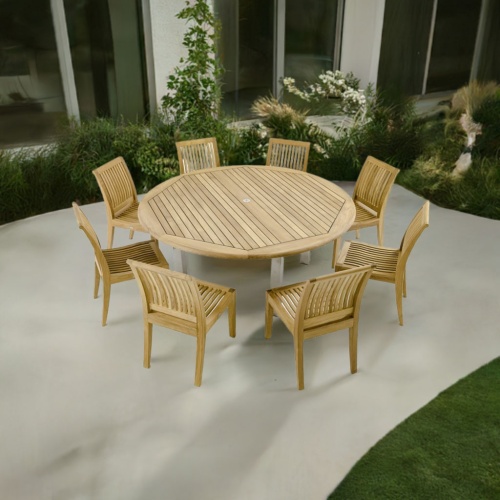 70488 Vogue Laguna Dining Set of 8 teak side chairs and a teak 72 inch round dining table angled aerial view on patio with plants and glass doors in the background