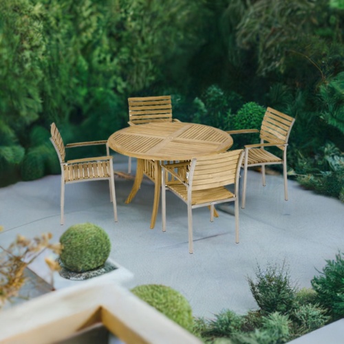 70581 Grand Hyatt Vogue Dining Set of Grand Hyatt Teak 48 inch Round Dining Table and 4 Vogue Dining Chairs on stone patio surrounded by landscaping plants aerial view with trees in background