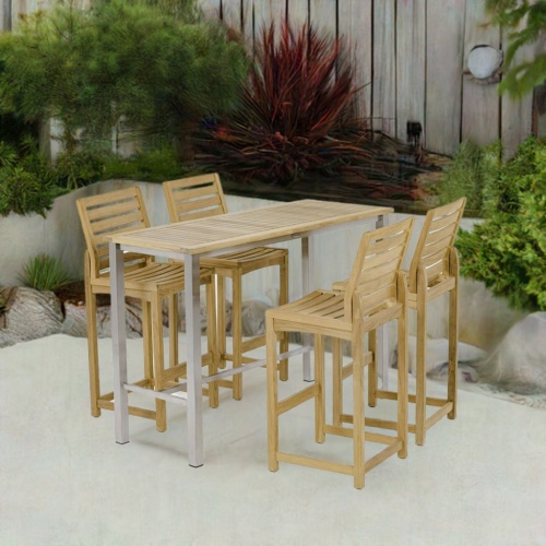 70631 Somerset Vogue 5 piece Rectangular Pub Barstool Set of a rectangular teak and stainless steel Bar Table and 4 teak side barstools end angled on patio with privacy fence in the background 