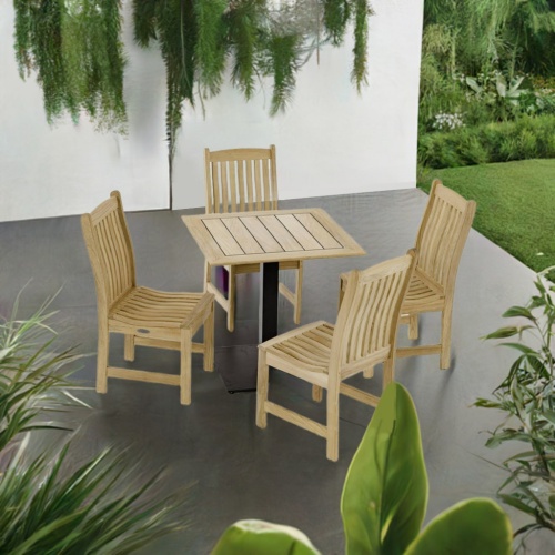 70699 Veranda 5pc Cafe Set of 4 teak dining side chairs and a 30 inch square teak dining table angled top view on outdoor pato surrounded with plants and wall in the background  