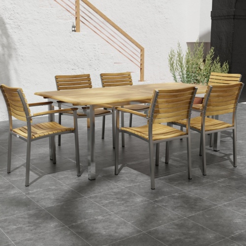 70756 Vogue 7 pc Dining Set with All Armchairs side angled on tiled patio with stairs and potted plant in background