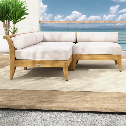 70822 Aman Dais 5 pc Sectional Set on outdoor terrace next to a potted tree against a wall and blue sky and ocean view in the background