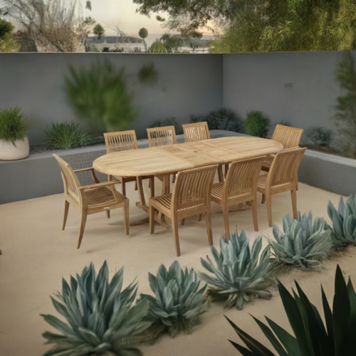 70926 Laguna Montserrat 9 pc Dining Set of Montserrat Oval Teak Table and 2 Laguna Dining Armchairs and 6 Laguna Side Chairs on terrace surrounded by plants and privacy wall with plants in planter in the background