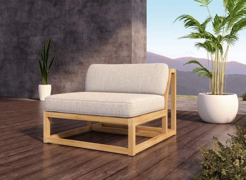 11800DP Maya Slipper Chair angled on wood deck in front of 2 potted plants and mountains in the background