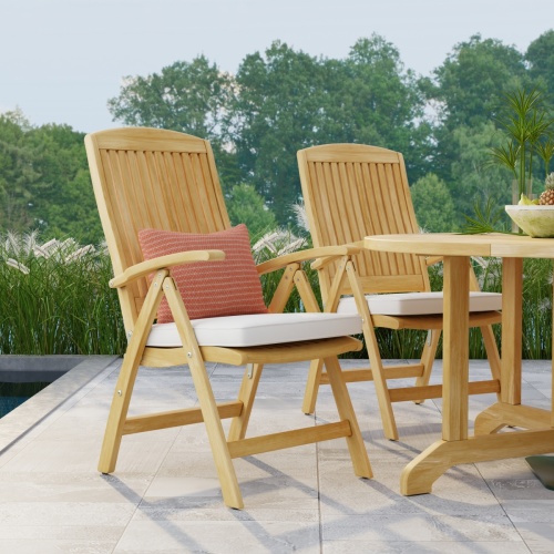 12569S Barbuda Recliner front view showing 2 on patio with optional seat cushions with trees and blue sky background