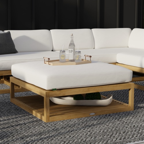 18800dp maya seating collection on outdoor patio with tray of 2 glasses and bottle water on ottoman and house in the background