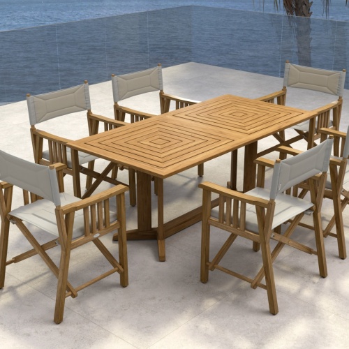 70360 Pyramid Director 7 piece teak Dining Set of 6 teak Director Chairs and Pyramid Teak Dining Table aerial view on stone patio with palm tree and ocean in background