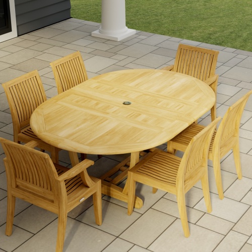 70363 Martinique Laguna 7 pc Dining Set of Martinique Teak Oval Table and 2 Laguna Dining Armchairs and 4 Laguna Side Chairs angled aerial view on tile patio with a pillar and grass in background 