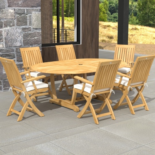 70366 Oval Odyssey Chair 7 pc Dining Set of Martinique Oval Table and 6 Odyssey Director Chairs on outdoor terrace with potted tree and ocean background