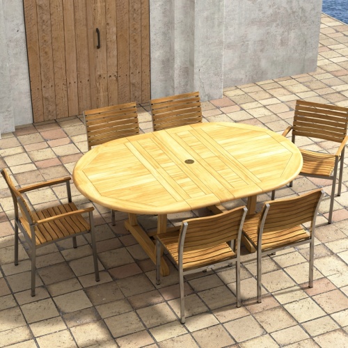 70370 Martinique Veranda 7 pc Oval Dining Set of Martinique Teak Oval Dining Table and 2 Veranda Armchairs and 4 Side Chairs on a patio in aerial view with wood doors in background