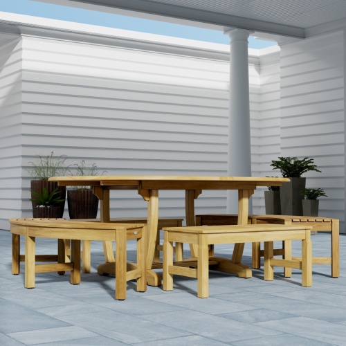 70380 Martinique 5pc Bench Dining Set of Teak Oval Dining Table and 2 Backless Curved Benches and 2 Backless Stools on outdoor patio with privacy wall and potted plants in background