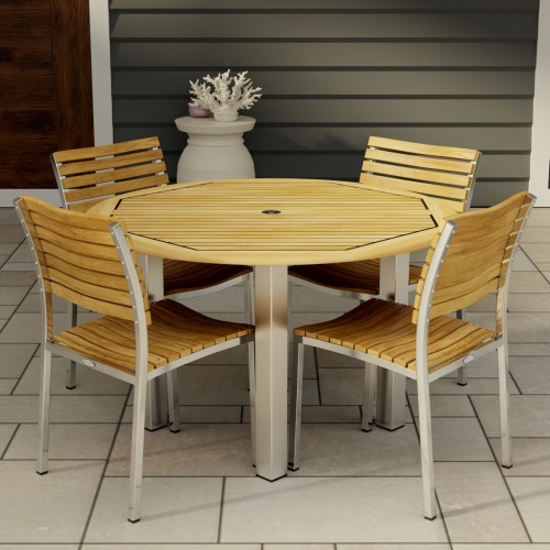 70438 Vogue Dining Set for 4 of Vogue Teak and Stainless Steel 48 inch Round Dining Table and 4 Vogue Stacking Dining Chair angled top on patio with a door of house in the background 