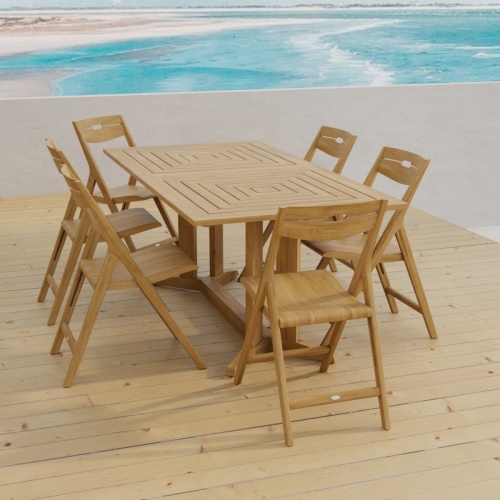 70538 Surf Pyramid Teak Dining Set for 6 angled end view on outdoor terrace with beach and ocean in the background 