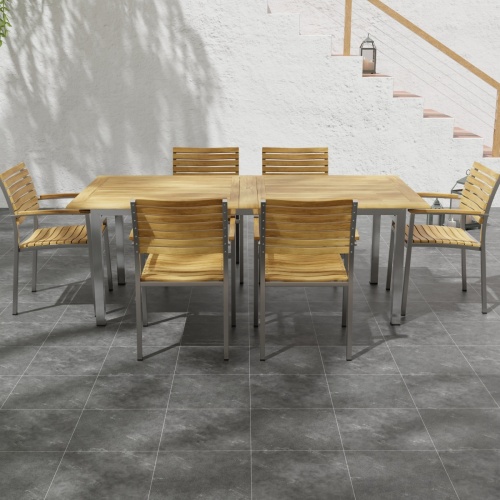 70756 Vogue 7 pc Dining Set with All Armchairs side view on tiled patio with stairs in background