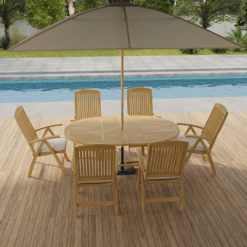 70367 Martinique Barbuda Recliner Dining Set with optional open umbrella aerial side view on patio in front of pool with plants and fence in background  