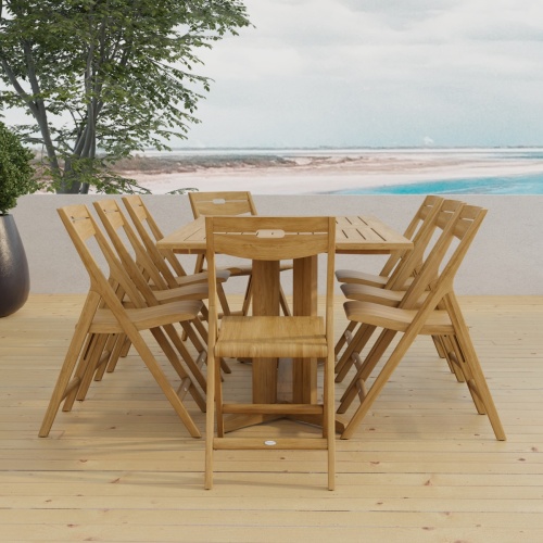 70464 Surf Pyramid Teak Dining Set for 8 end view on outdoor terrace with trees and ocean in background 