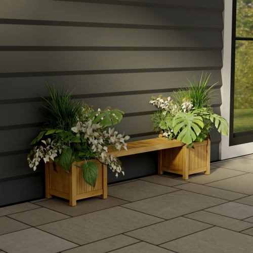 70530 Single Planter Bench Set of 2 planters filled with plants and 1 seat panel front view on stone patio next to a window with a house wall in background