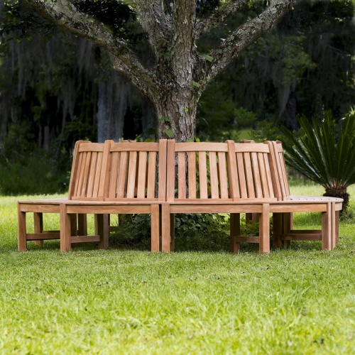 13691ST Buckingham Teak Tree Hugger Bench on grass field around a tree