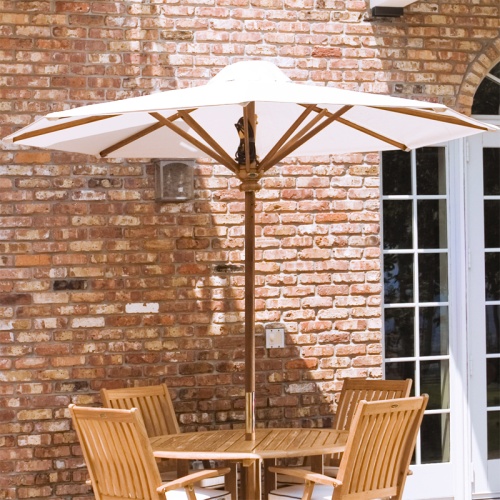 17540F Somerset 8 foot Round teak Umbrella extended on round patio set next to brick house and french doors in background