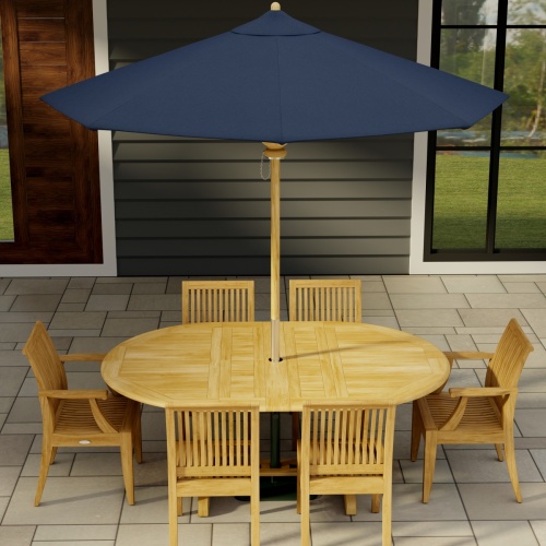 70363 Martinique Laguna 7 pc Dining Set angled aerial view with optional open umbrella in table center on tile patio with a door and window of house in background