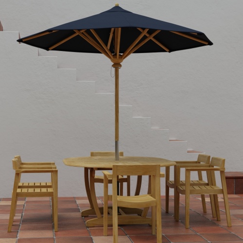 70364 Martinique Horizon teak 7 pc Dining Set of Martinique Dining Table and 6 Horizon Armchairs and optional opened umbrella in side view on tiled terrace with staircase of house in back