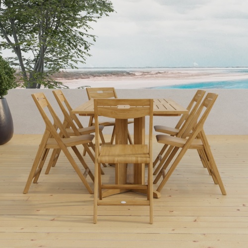 70538 Surf Pyramid Teak Dining Set for 6 end view on outdoor terrace with trees and ocean in background 