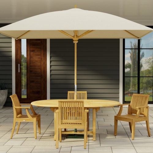 70305 Martinique 5 piece Dining Set with optional rectangular umbrella in side view on stone patio with a house and door and window in the background