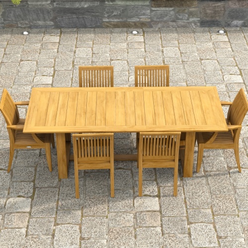 70377 Horizon Laguna 7 pc Teak Dining Set showing angled aerial view of Horizon Dining Table and 2 Laguna DIning Arm Chairs and 4 Side Chairs on a stone paver patio 