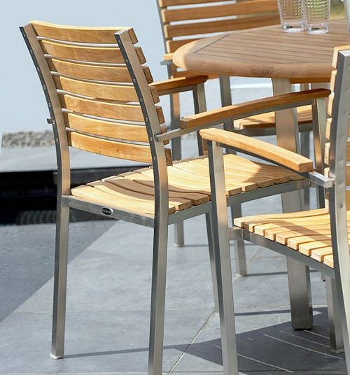 22007 Vogue Stacking Armchair right angled view on concrete patio