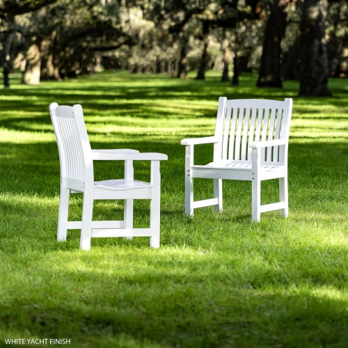 12218 Veranda Chair With Arms with Poly Finish showing 2 on grass lawn with trees in the background