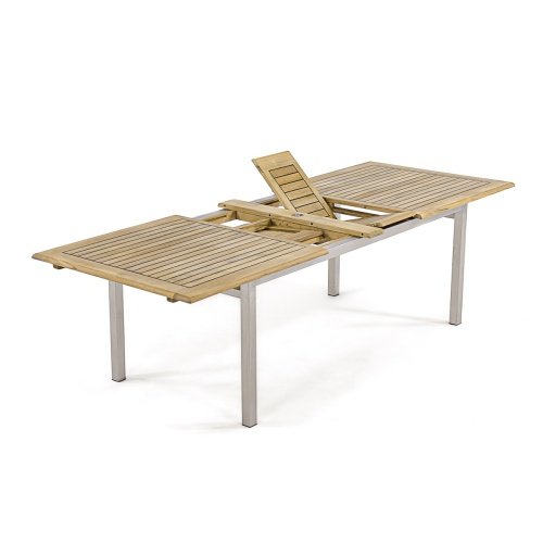 25025 Vogue teak and stainless steel extension dining table side angled view showing extended position with butterfly leaves open on white background