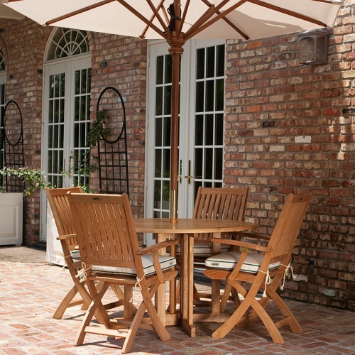 70066 5pc Barbuda Round folding set on patio by french doors brick house