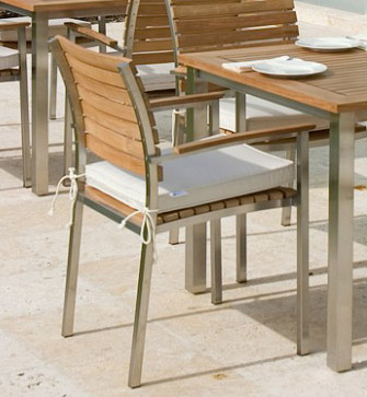 22007 Vogue Stacking Armchair right angled view on concrete patio