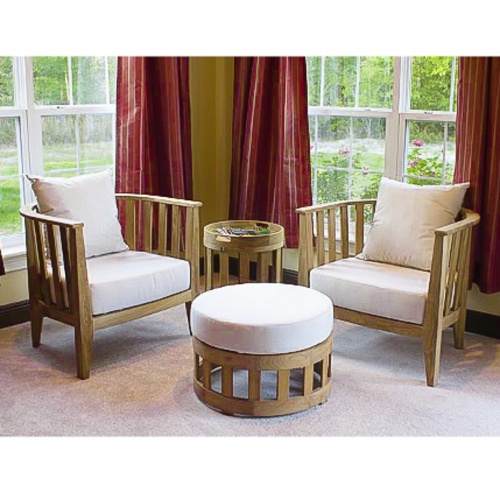 12170DP Kafelonia teak Barrel Chair showing 2  Kafelonia teak Barrel Chairs with ottoman and side table on carpet indoors in front of windows with plants in the background 