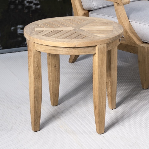 70849 Laguna round teak Side Table closeup angled side view next to Laguna sofa